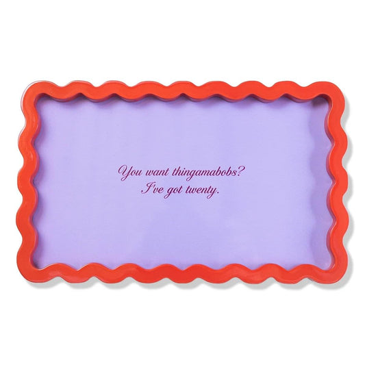 a purple and red frame with a scalloped edge