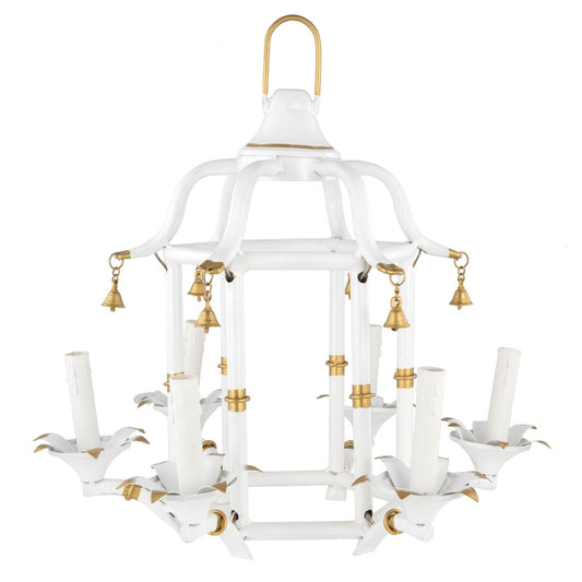 a white chandelier with gold bells