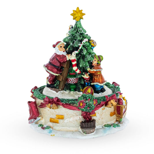 a christmas tree with santa and snowman figurine