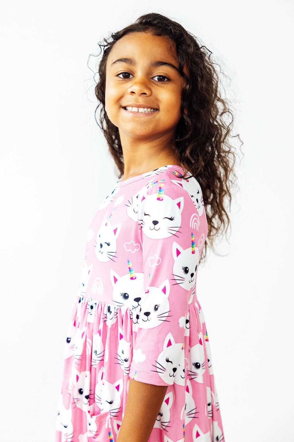 a girl in a pink dress