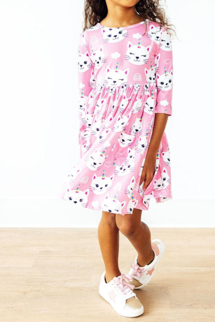 a girl in a pink dress