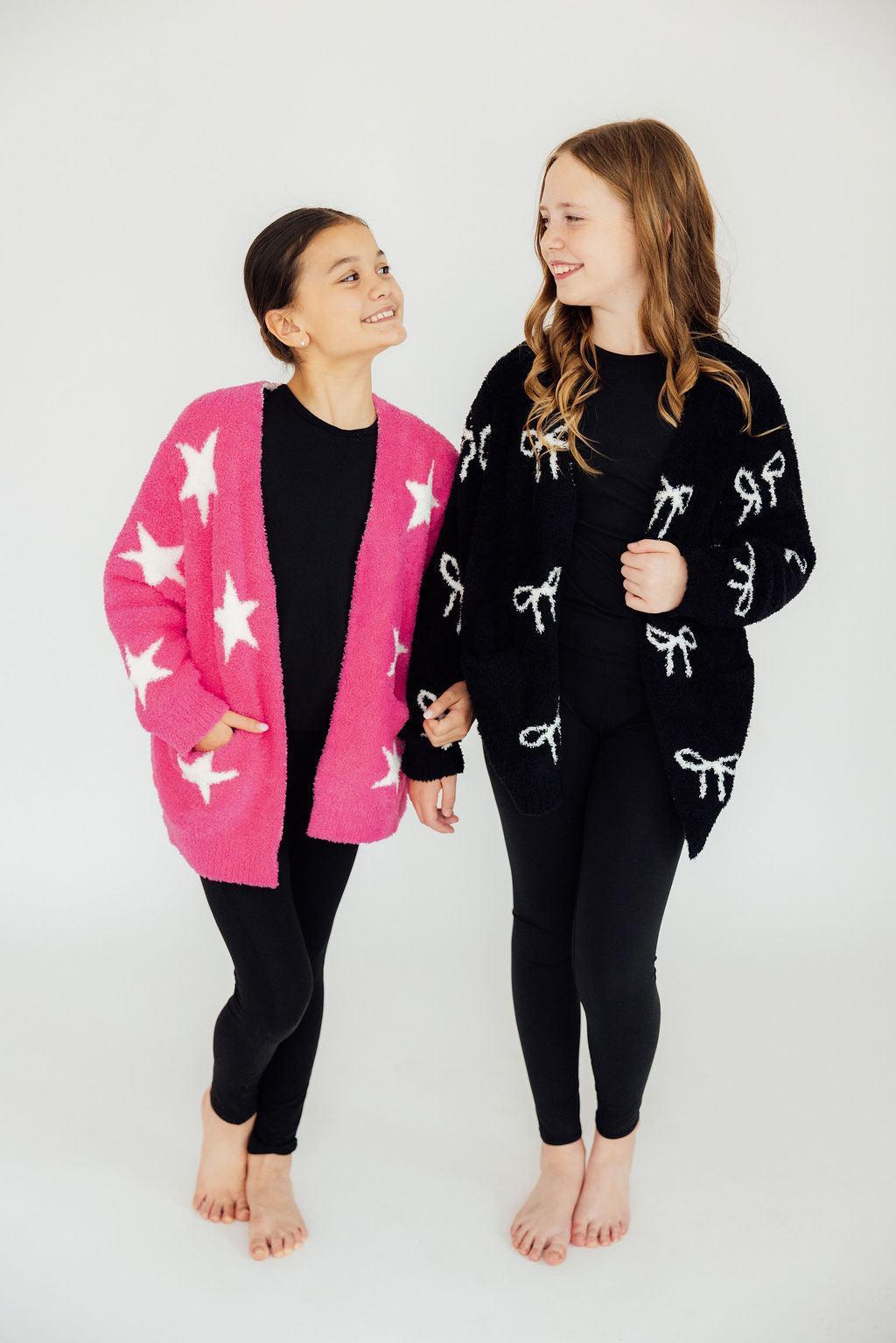 two girls standing together smiling