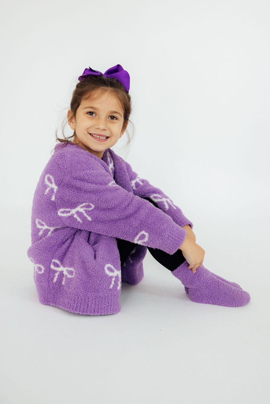 a girl sitting on the floor