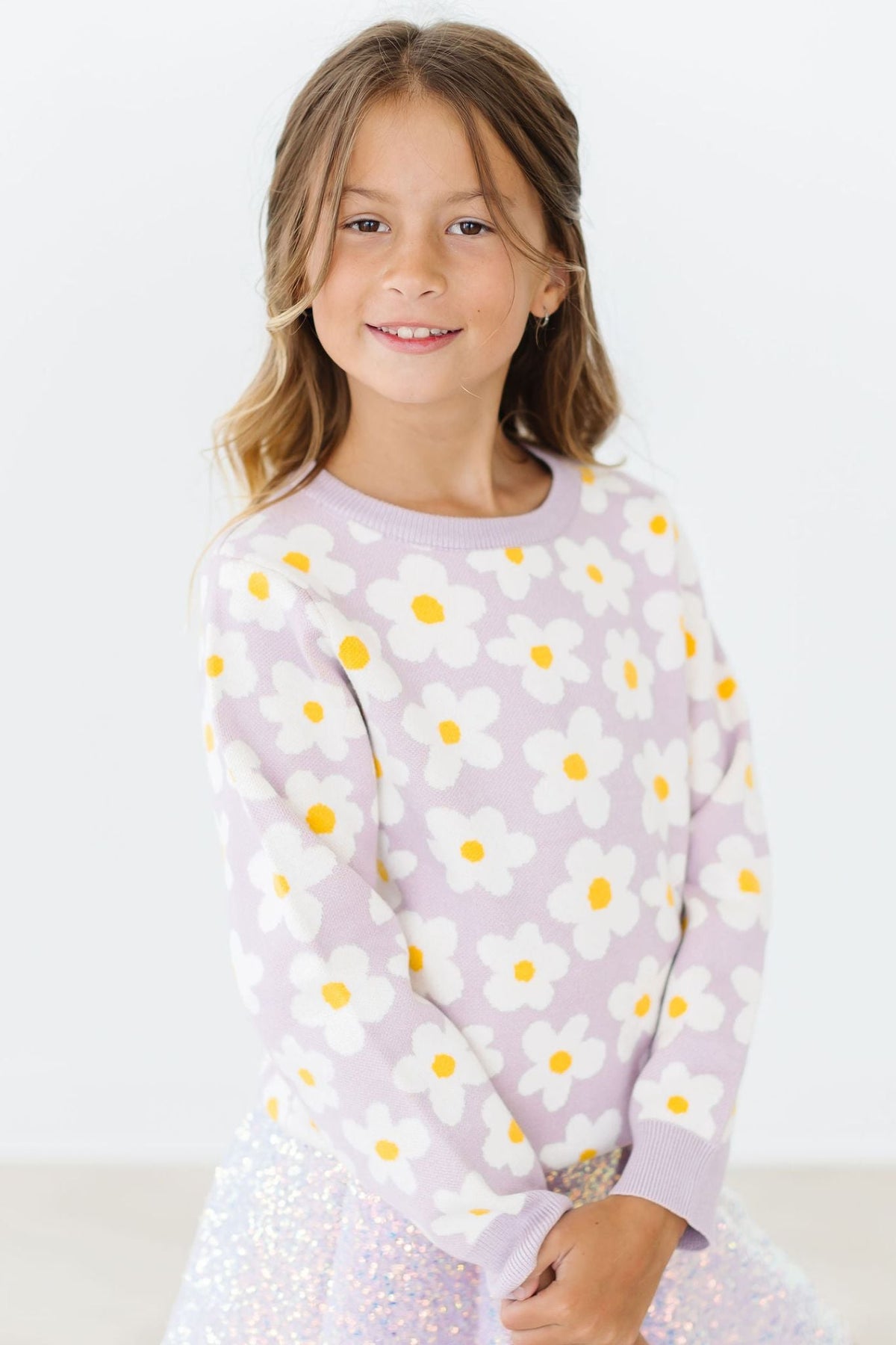 a girl smiling at the camera