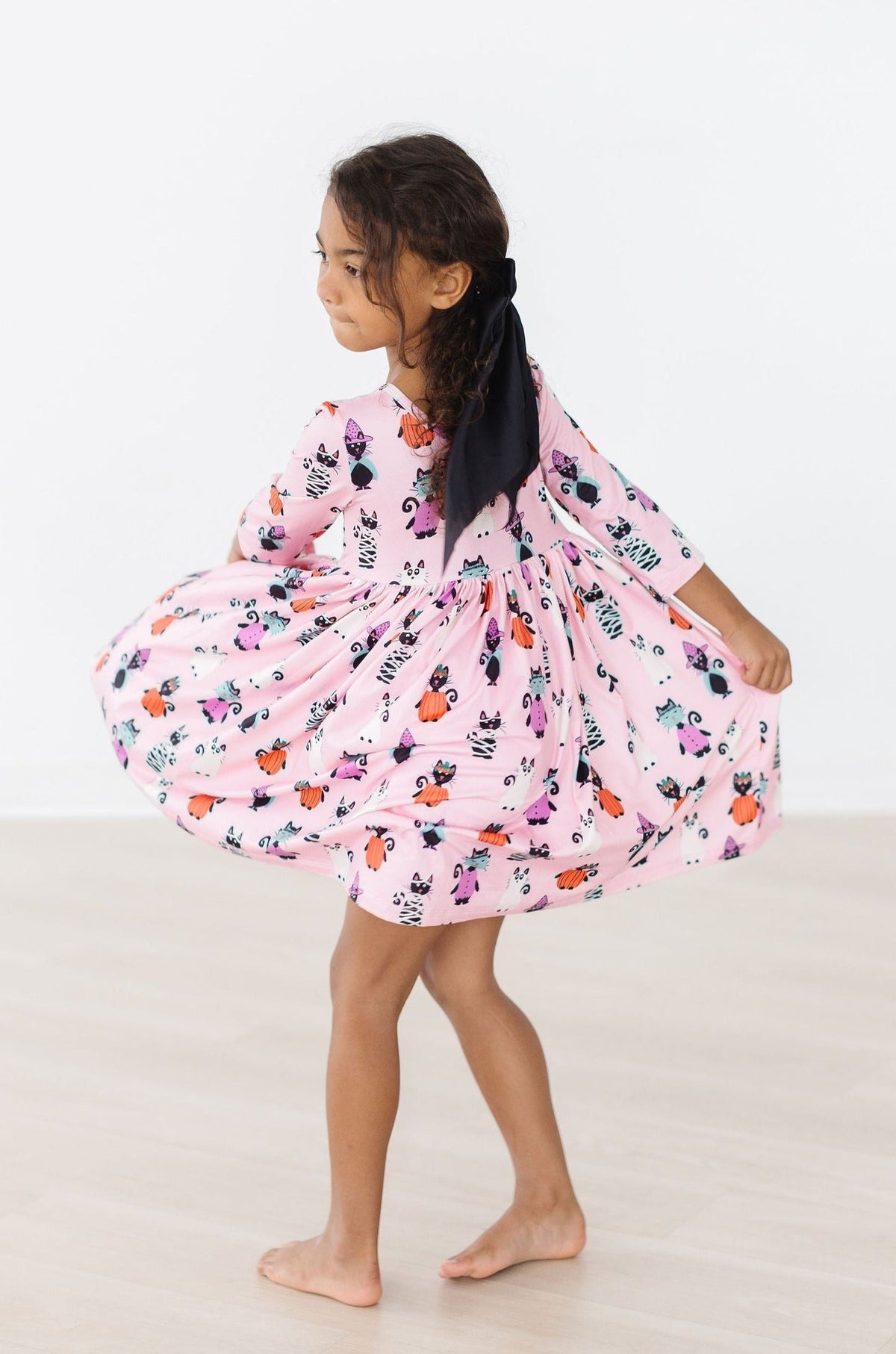 a girl in a pink dress