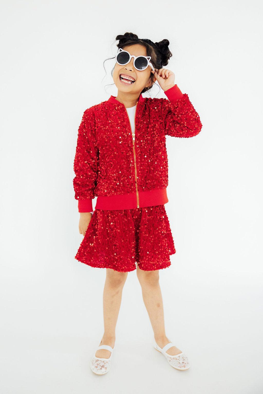 a girl in a red outfit