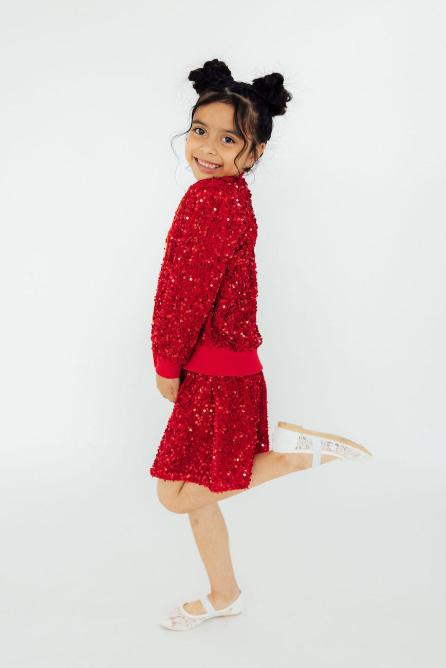 a girl in a red dress