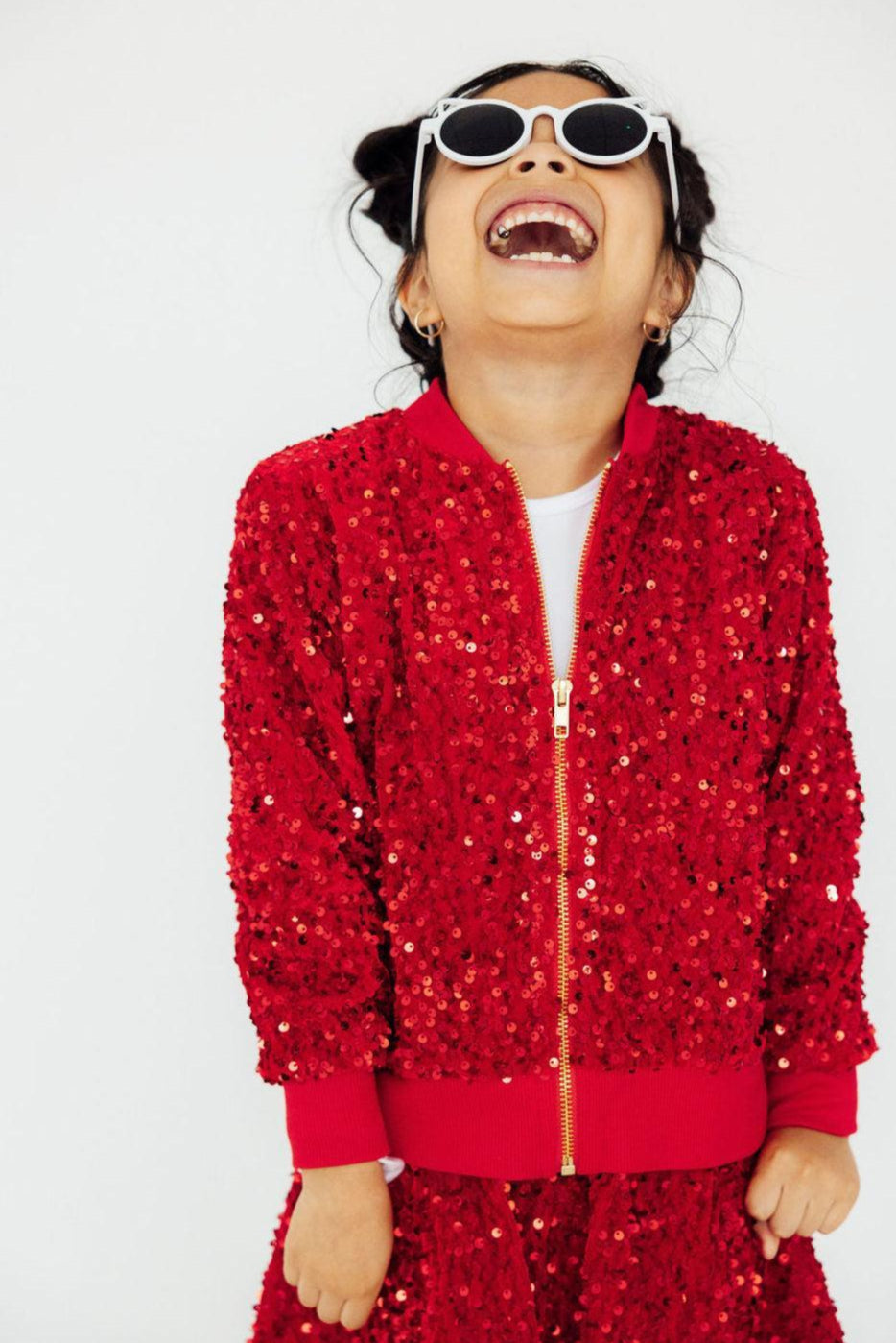 a girl in a red jacket