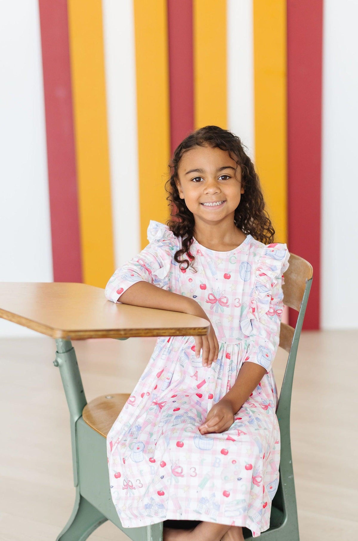 a girl sitting at a desk