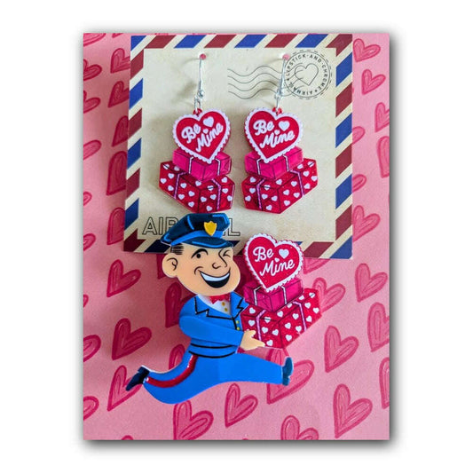 a pair of earrings on a envelope