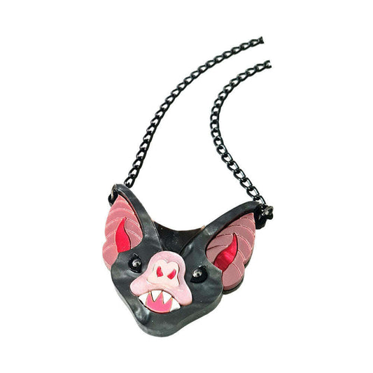 a black and pink bat necklace