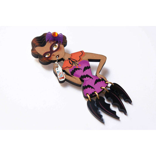 a cartoon figurine of a woman holding a bottle