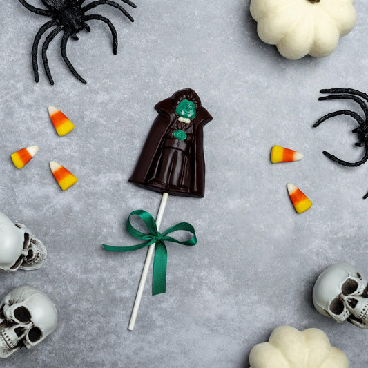 a candy and skulls around a lollipop