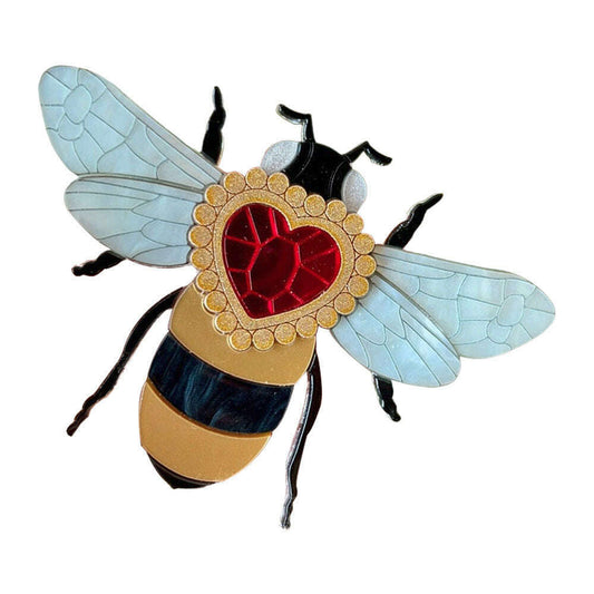 a bee with a heart shaped jewel