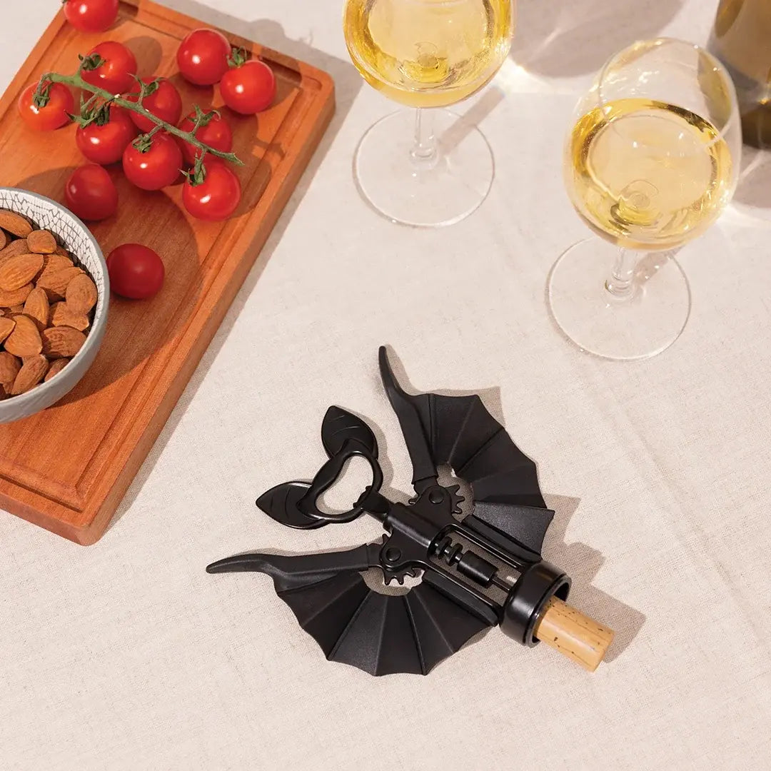 a bottle opener and wine glasses