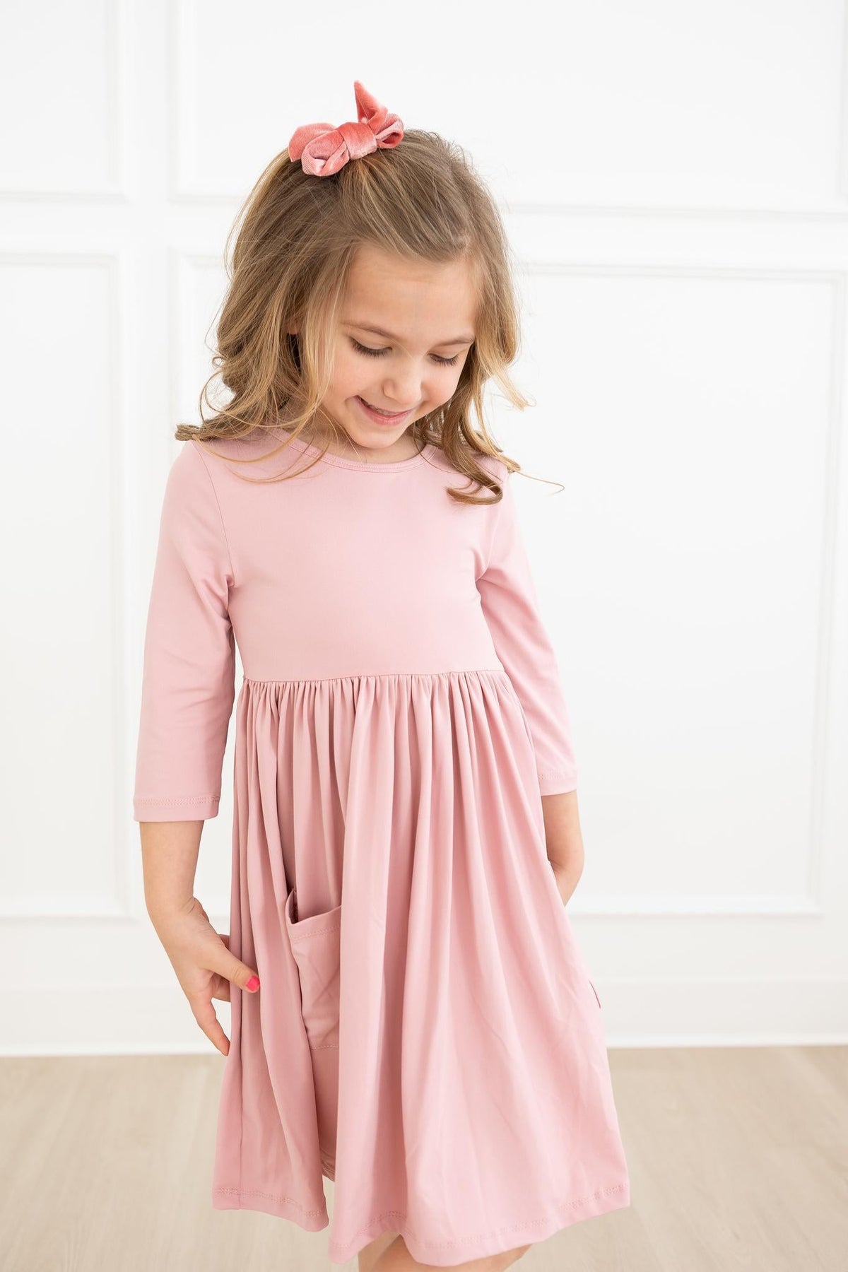 a girl in a pink dress