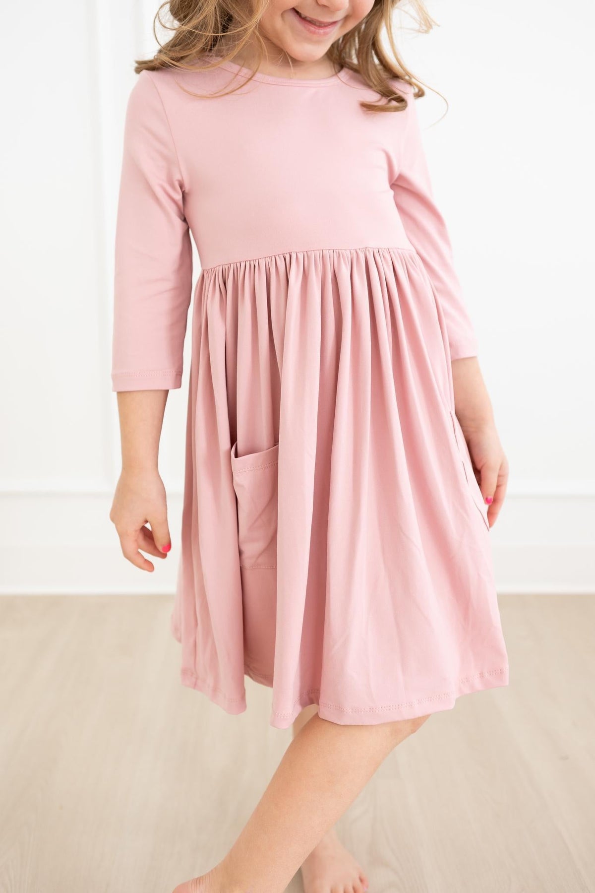 a woman wearing a pink dress
