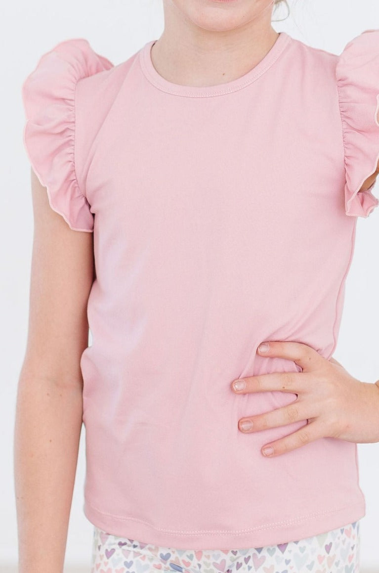 a girl wearing a pink dress