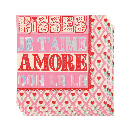 a stack of pink and white napkins