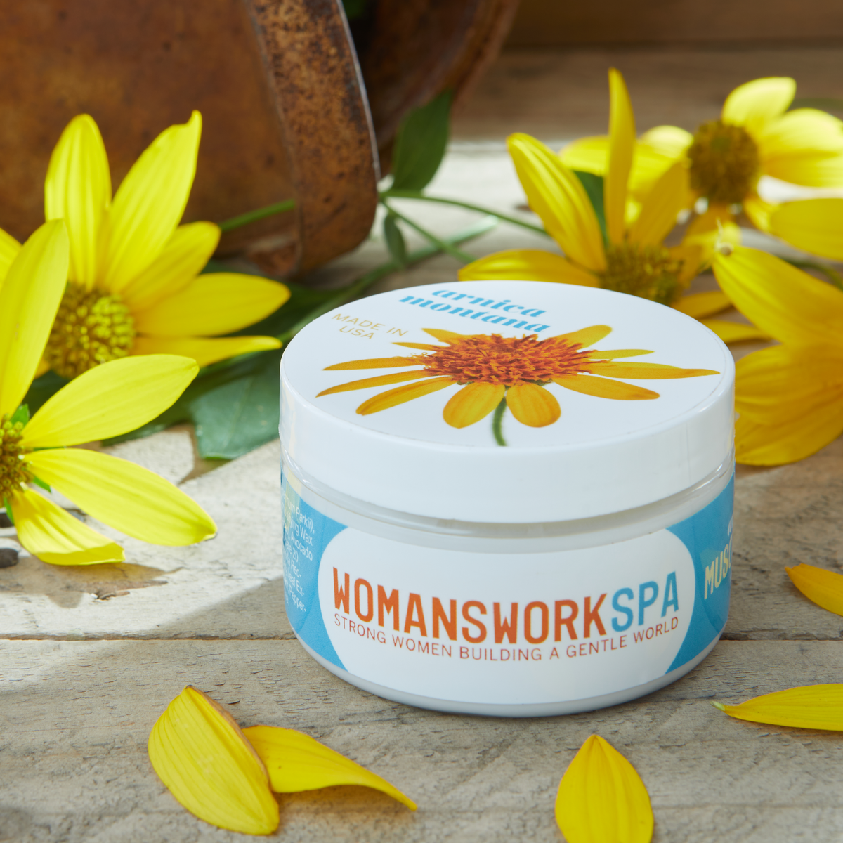 a jar of cream with yellow flowers