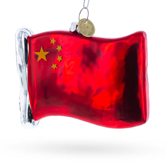 a red flag with gold stars and a silver handle