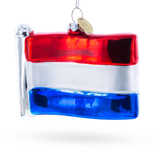a glass ornament with a flag