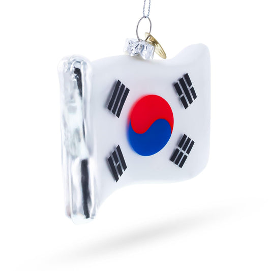 a glass ornament with a flag