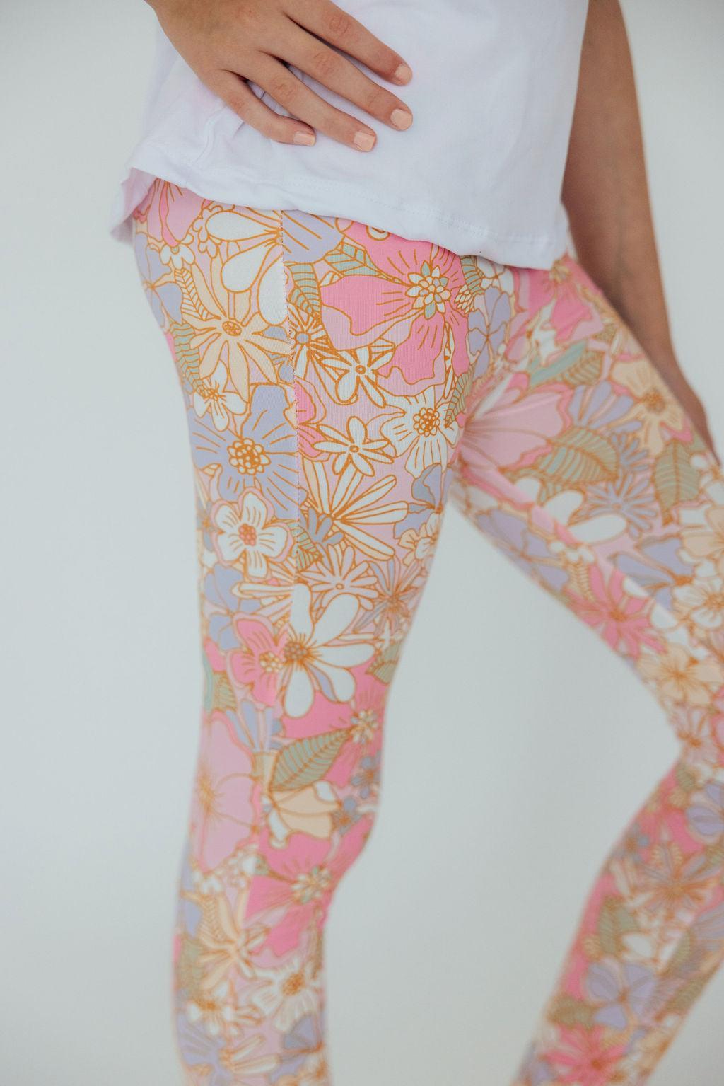 a person wearing floral leggings