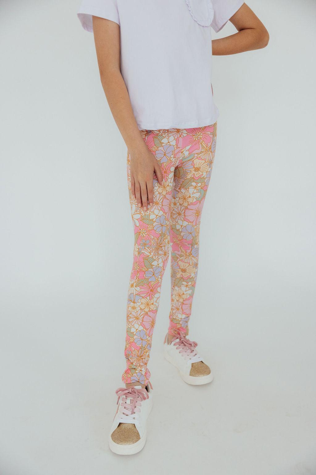 a person wearing floral pants