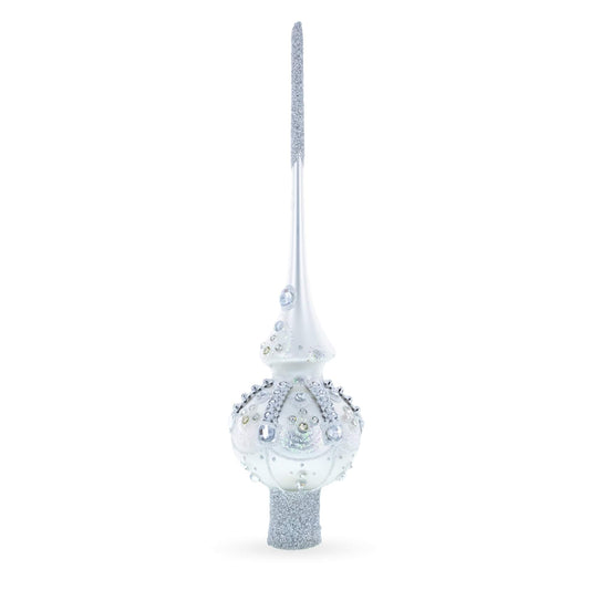 a white and silver christmas tree topper