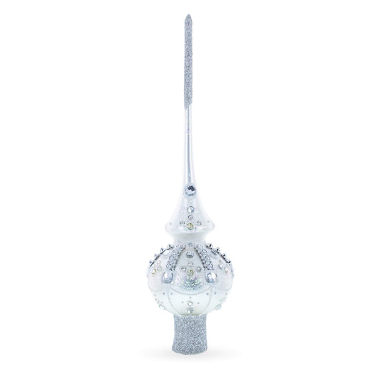 a white and silver christmas tree topper