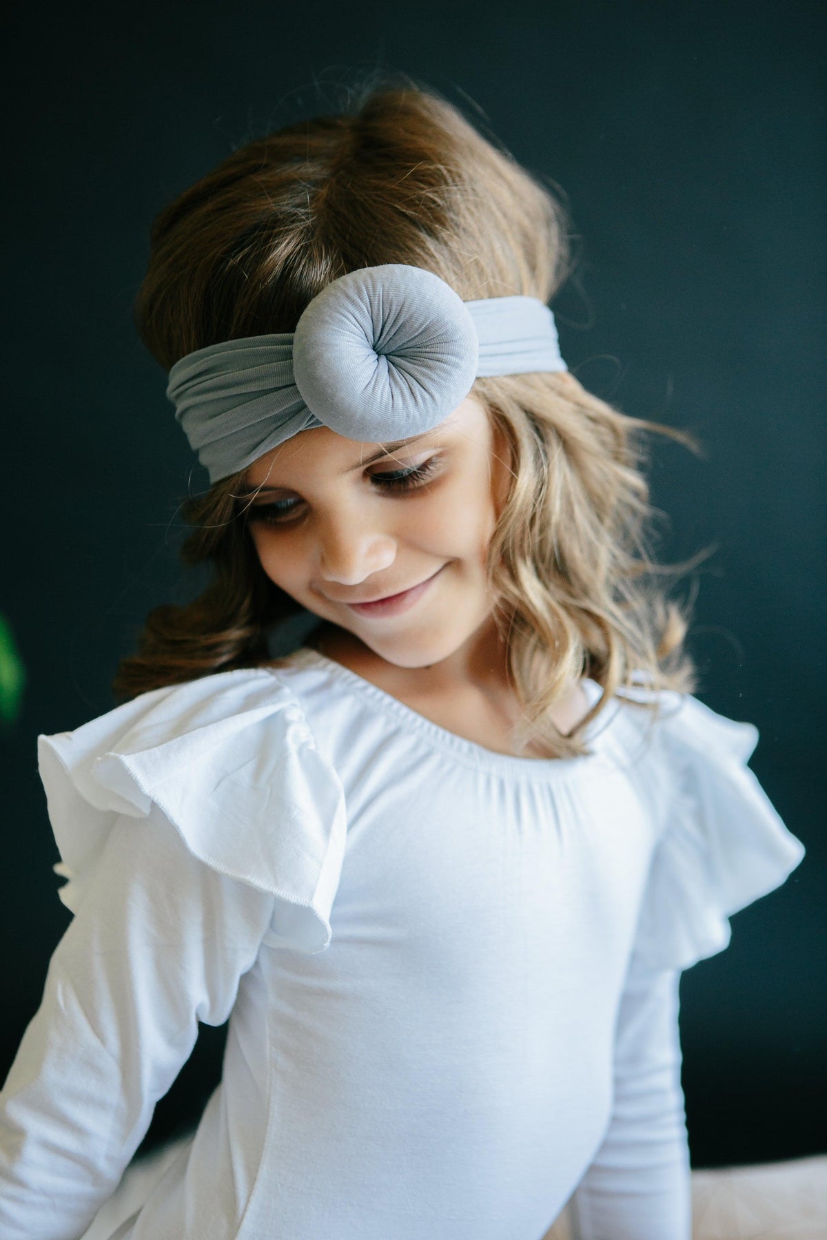 a girl wearing a headband