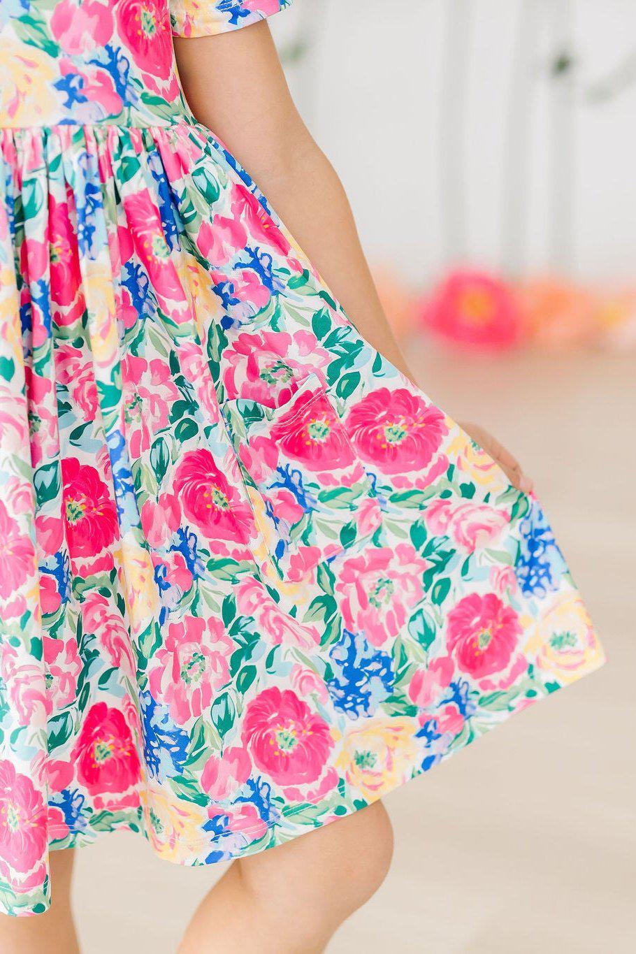 a woman wearing a floral dress