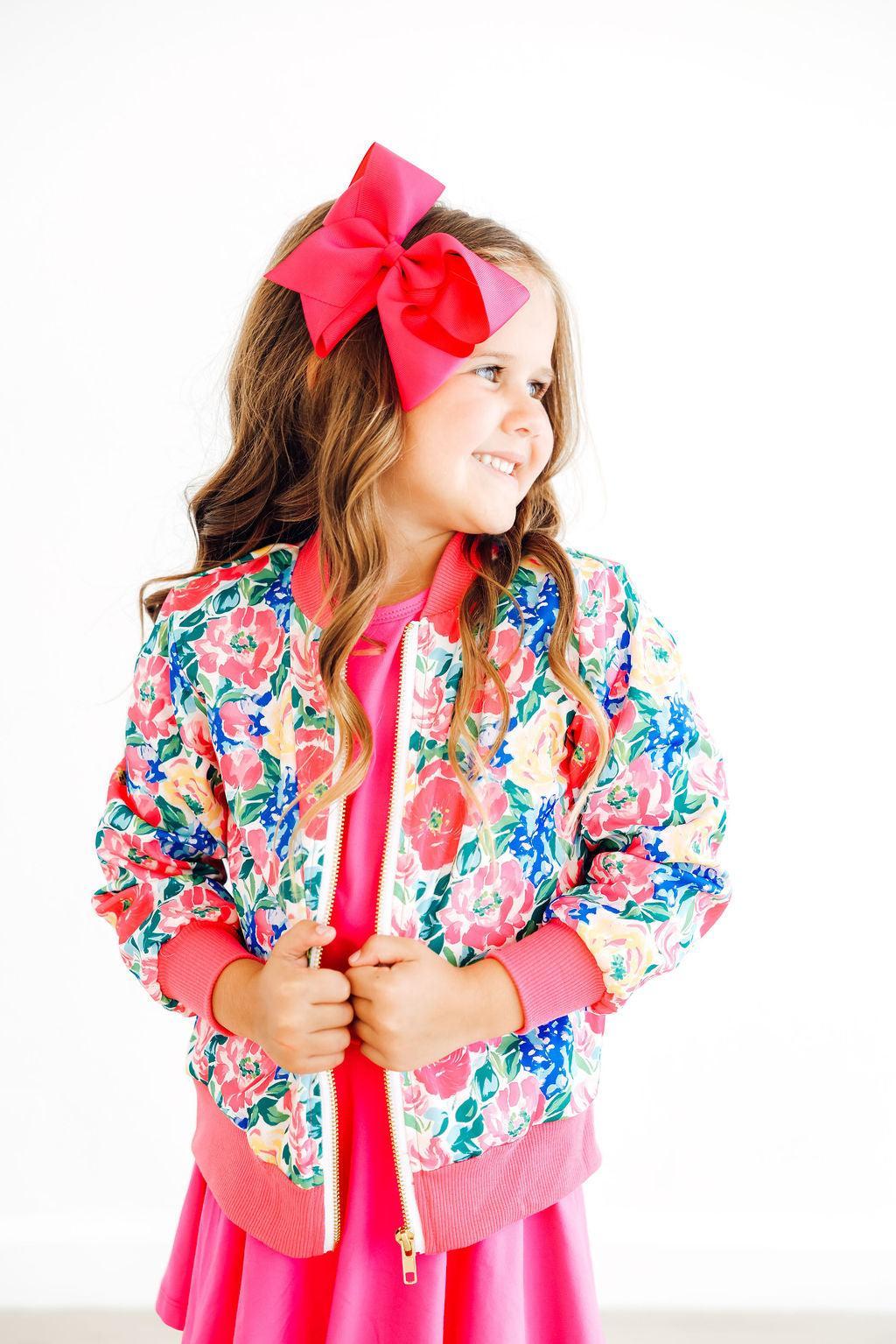 a girl with a bow in her hair