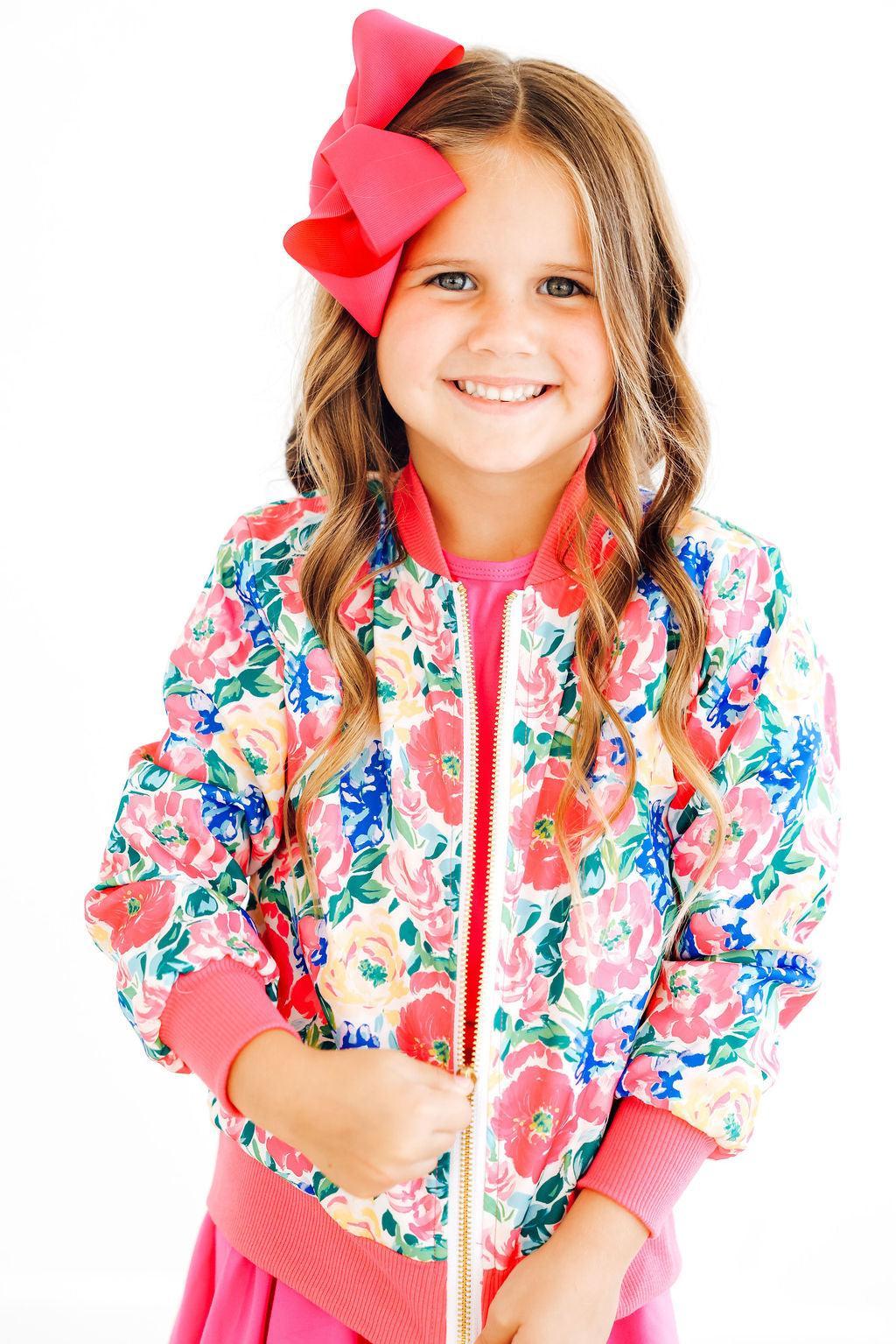 a girl smiling at the camera