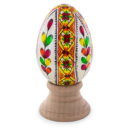 a painted egg on a stand