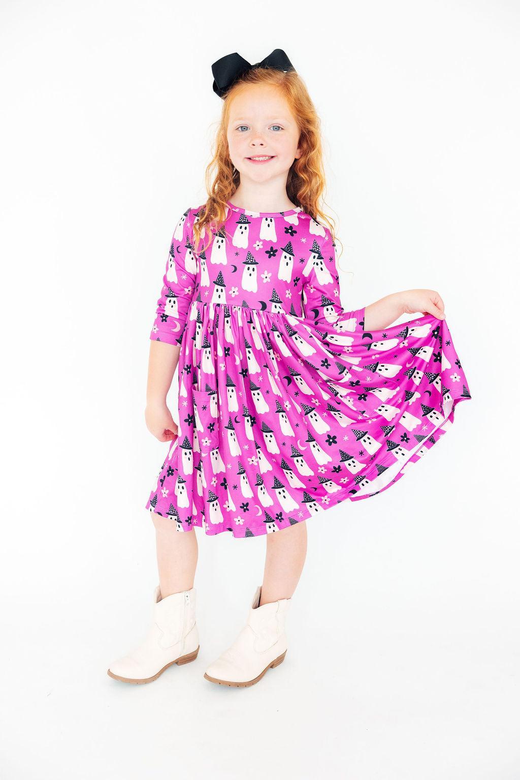 a girl in a pink dress