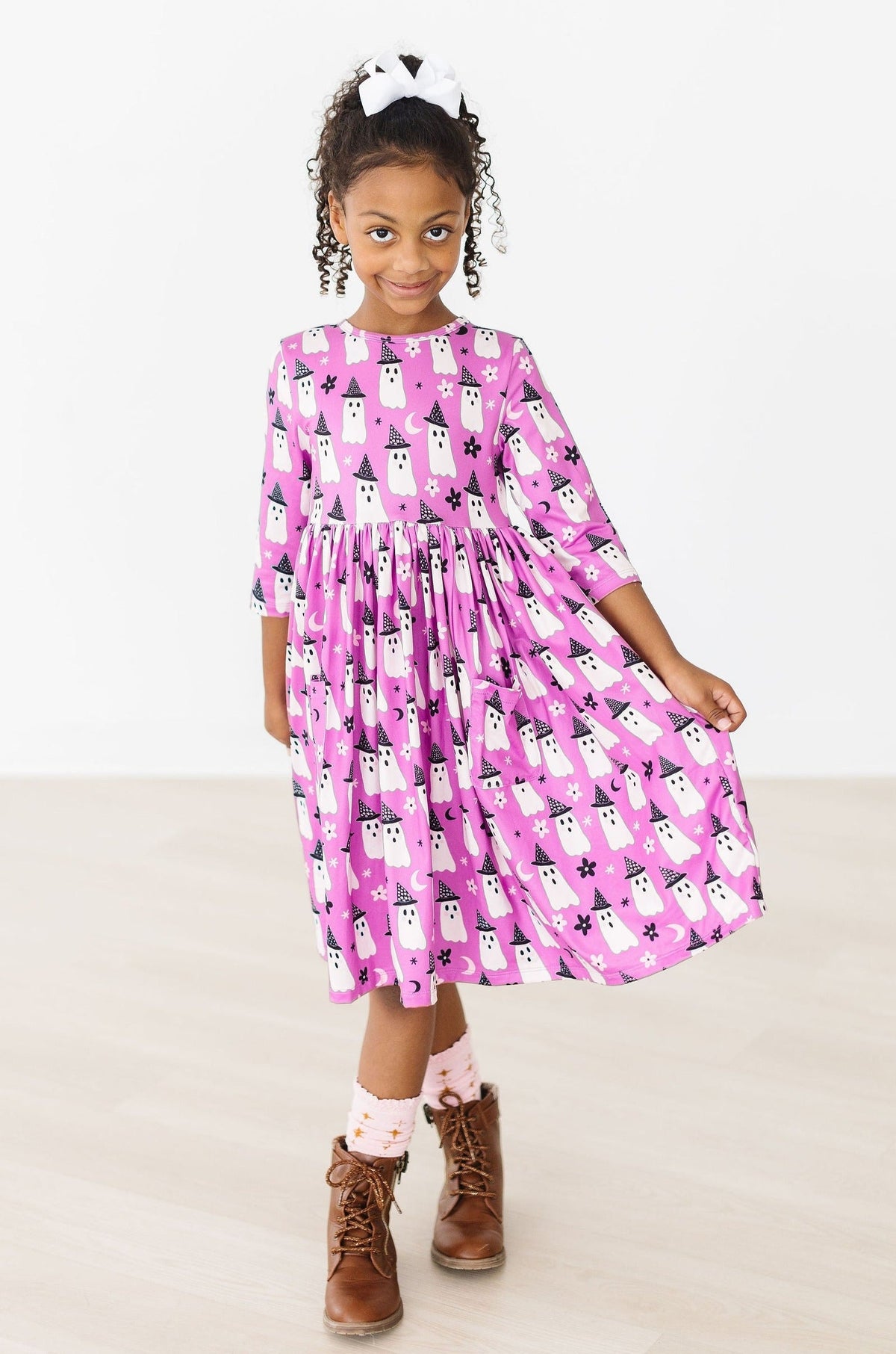 a girl in a pink dress