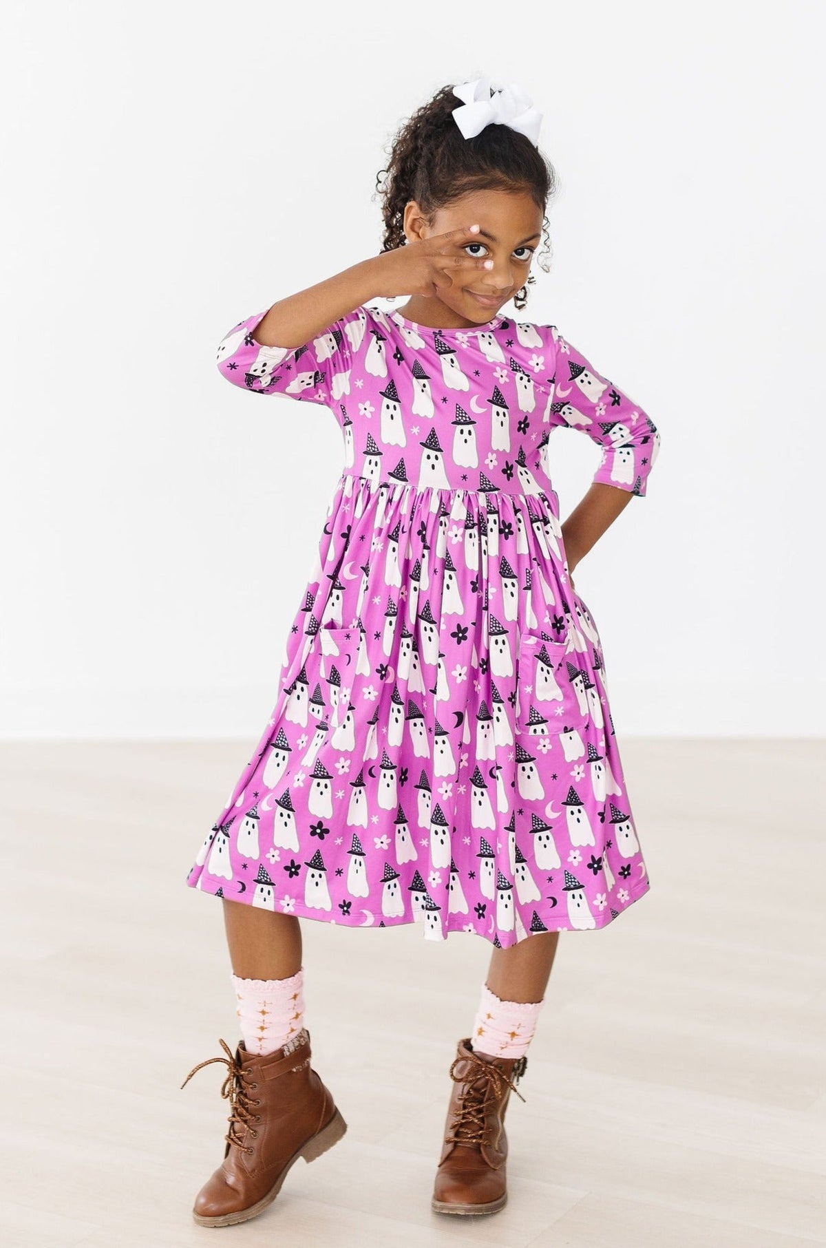 a girl in a pink dress