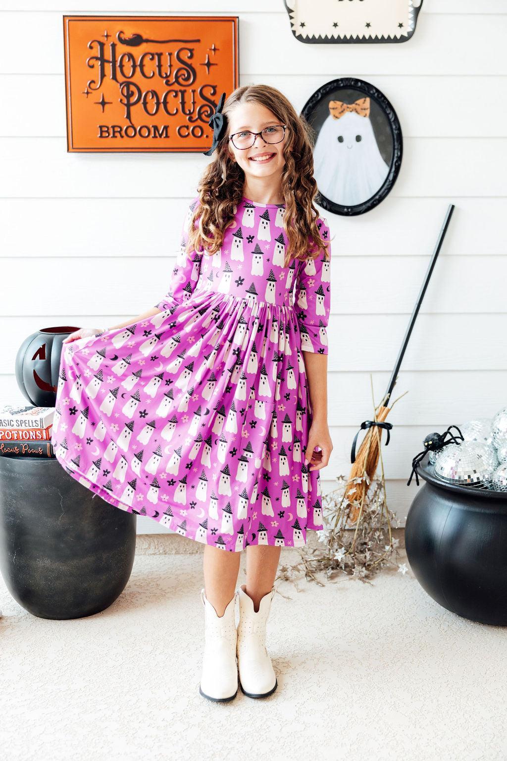 a girl in a pink dress