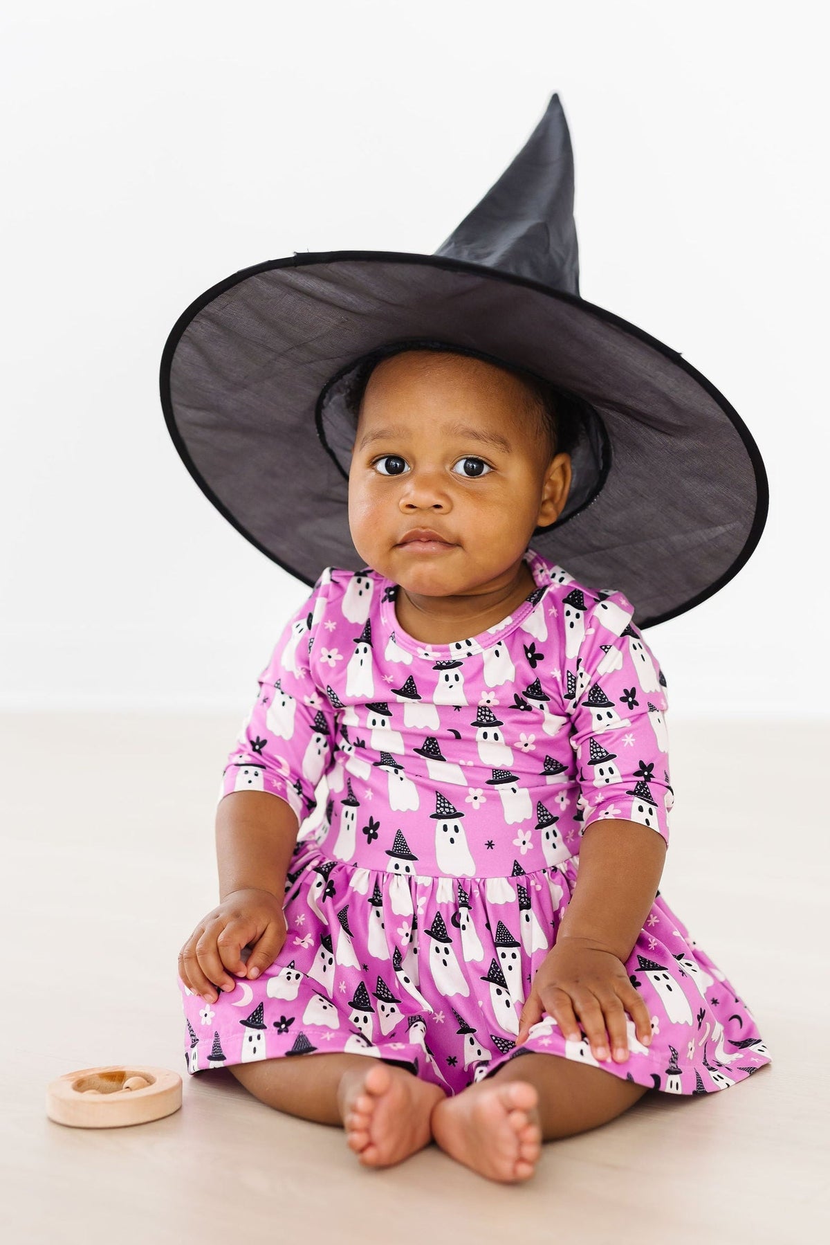a baby wearing a person hat
