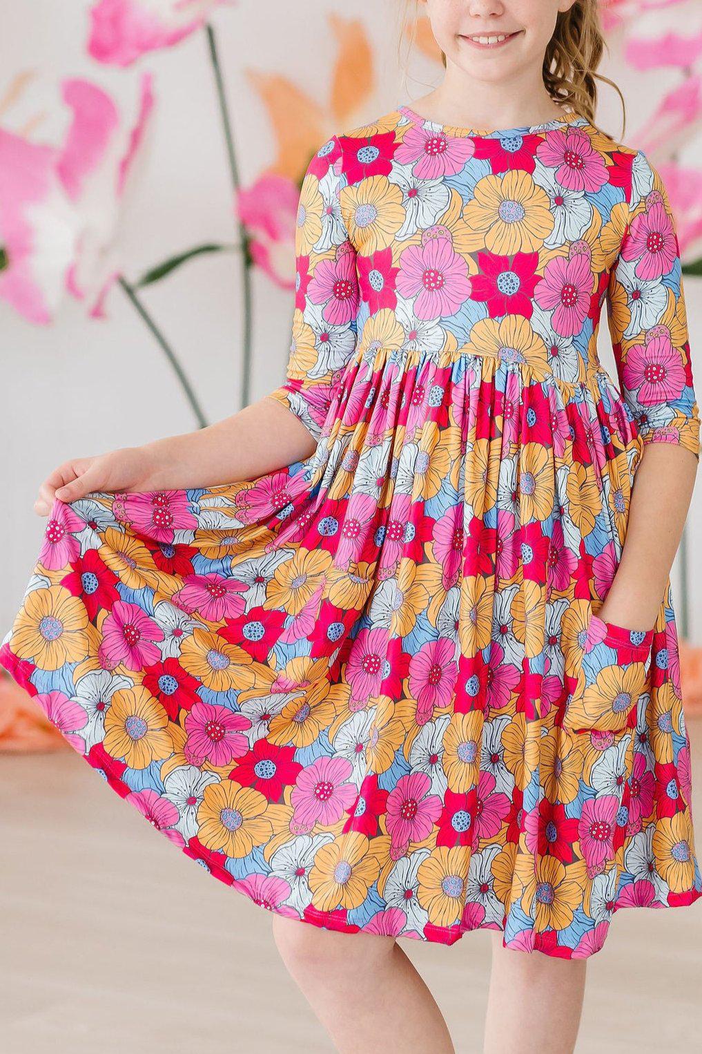 a girl in a colorful dress