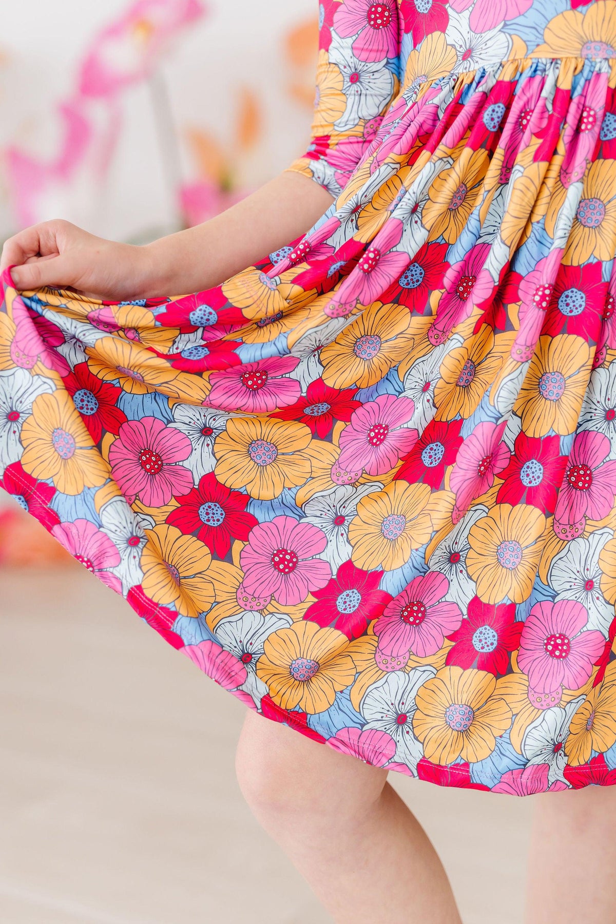 a woman holding a dress