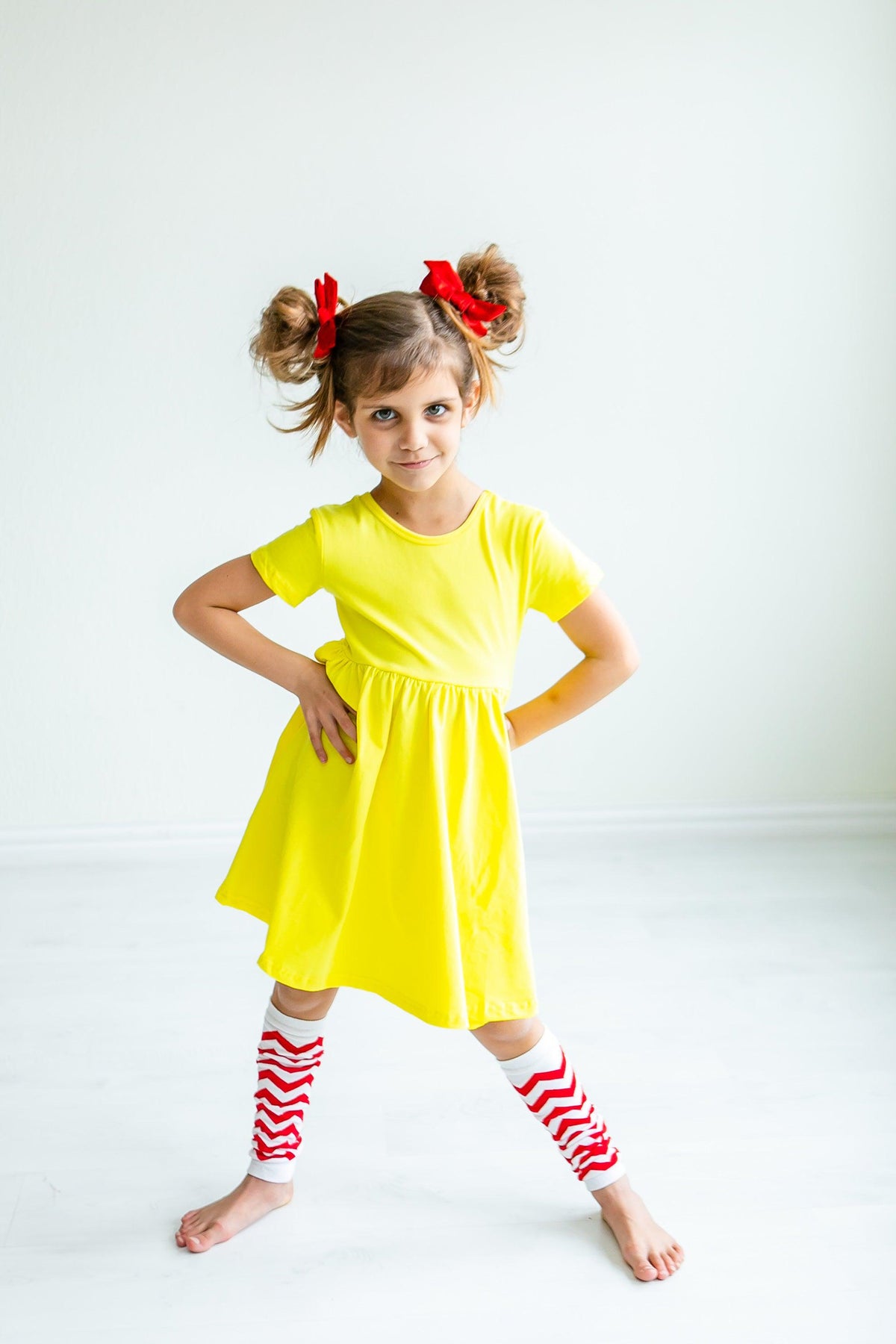 a girl in a yellow dress