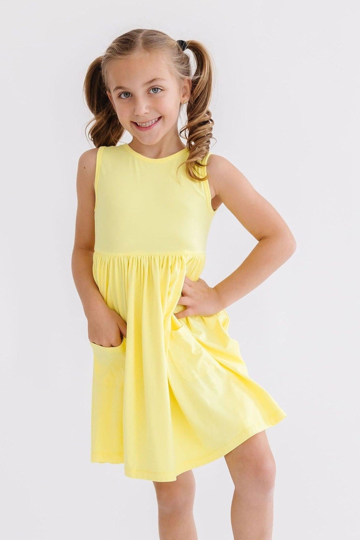 a girl in a yellow dress