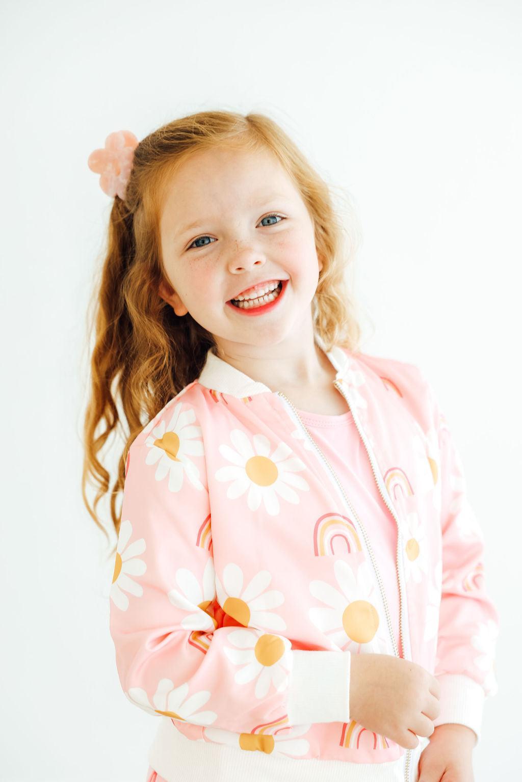 a girl smiling at the camera
