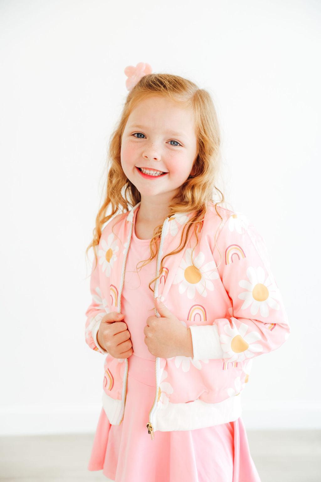 a girl smiling with her thumb up