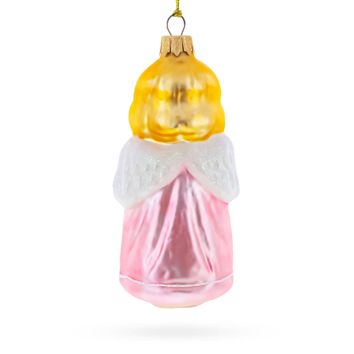 a glass ornament with a gold and pink dress