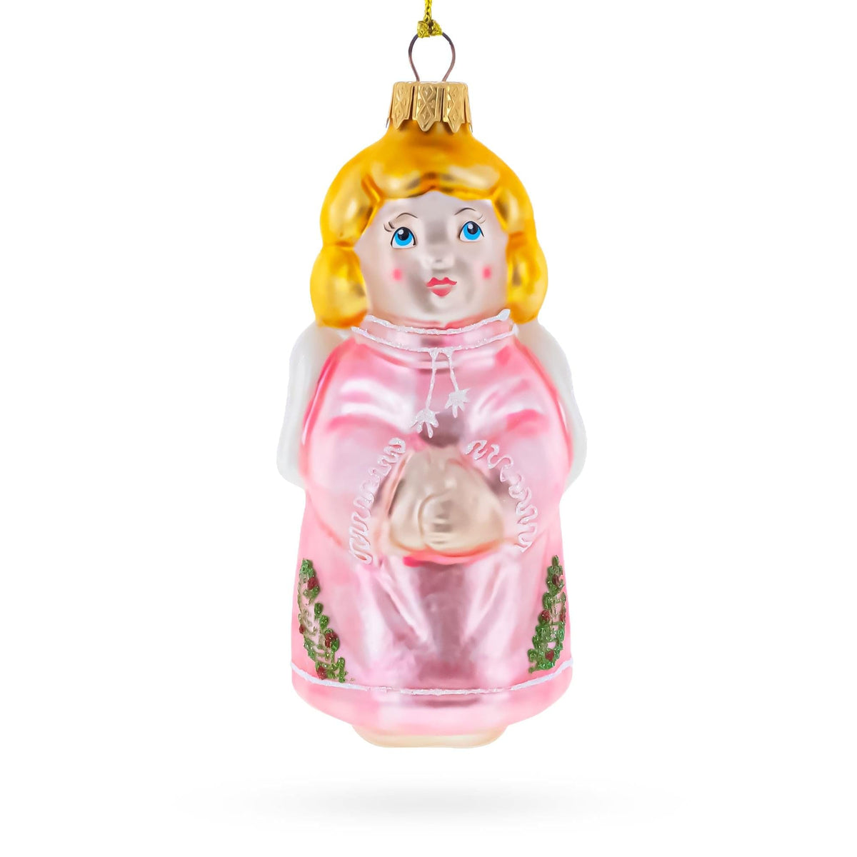 a glass ornament with a girl in a pink dress