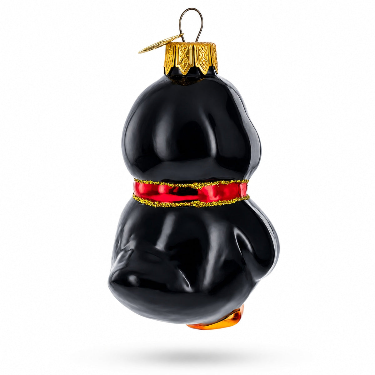 a black christmas ornament with a red ribbon